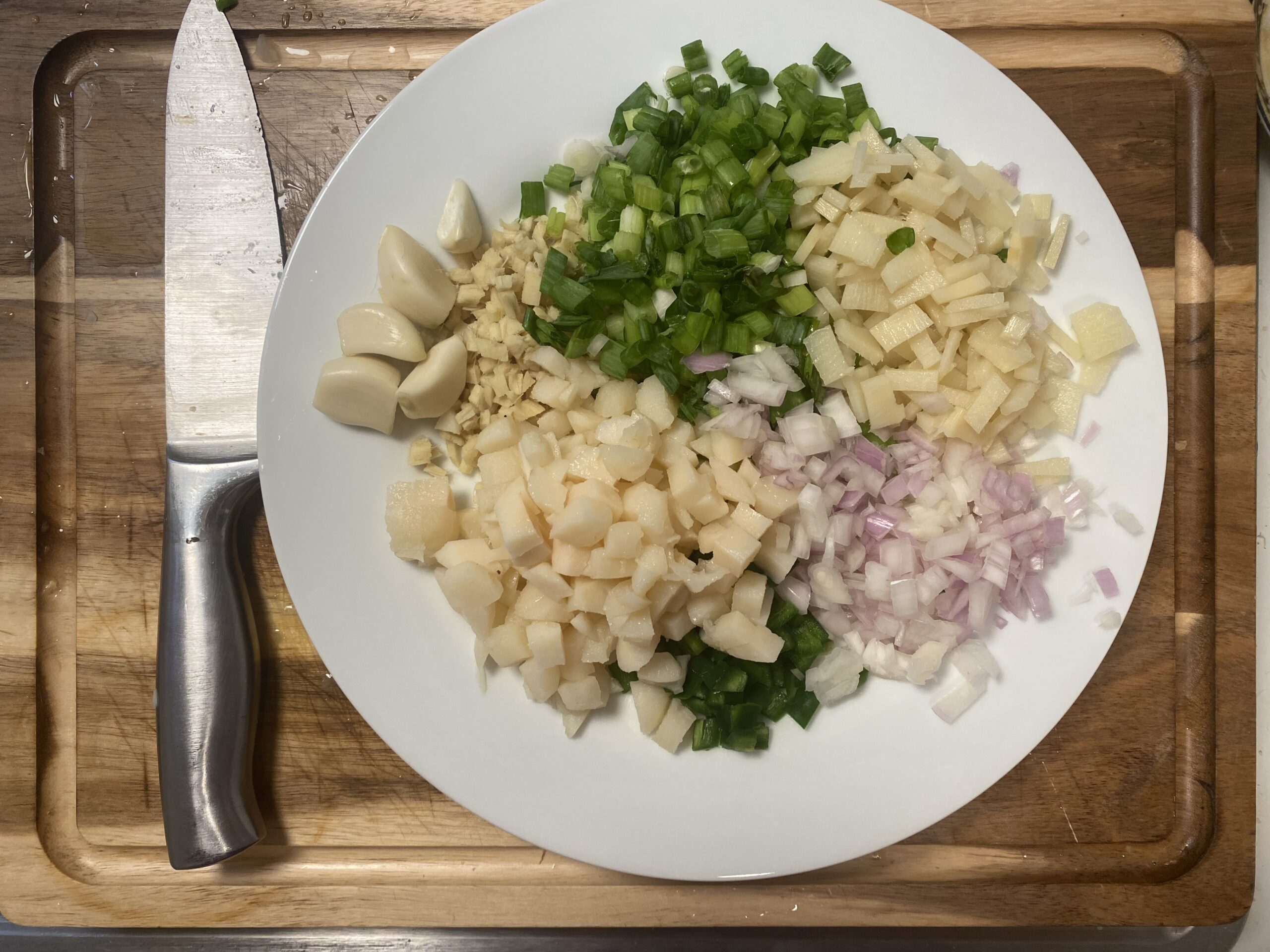 Finely chopped aromatics and vegetables arranged for P.F. Chang’s copycat lettuce wraps