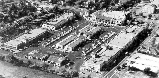 Aerial view of the completed Highland Park Village complex surrounding its central parking court