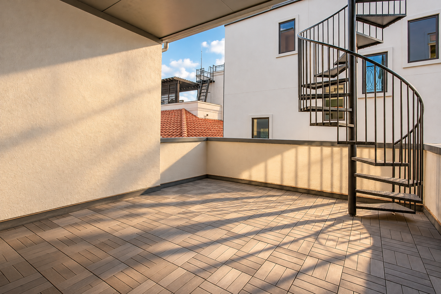 Outdoor terrace with spiral staircase at 2211 Worthington Street